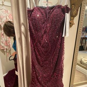 A beautiful mother of the bride dress with sheer matching shall.  Worn once